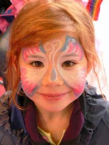 child with face paint at the fair